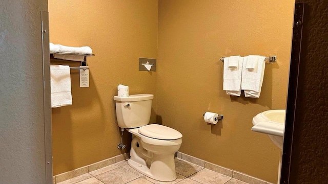 bathroom featuring toilet and tile patterned floors