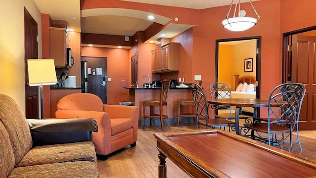 living room featuring pool table and light wood-type flooring