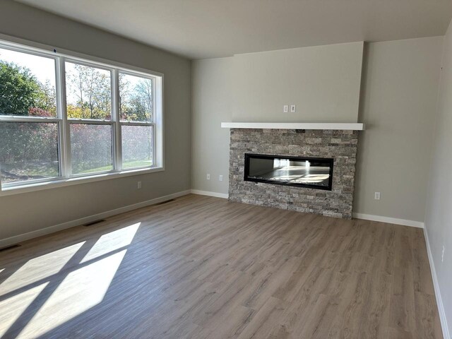 N9248 Constellation Dr, Appleton, WI 54915 - unfurnished living room with wood finished floors and a fireplace