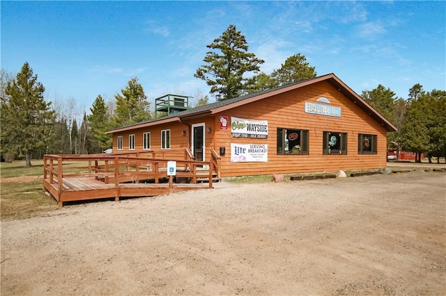 view of front of house featuring a deck