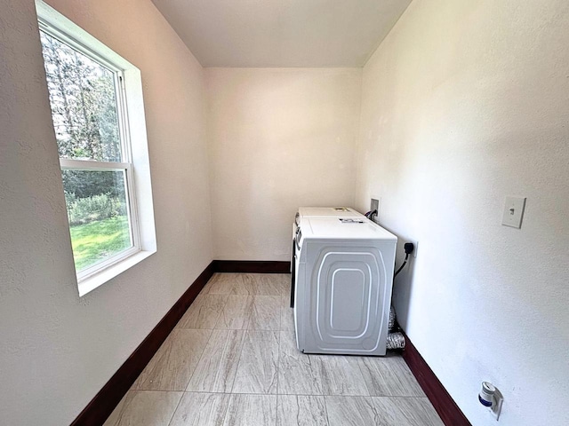 washroom featuring washer / dryer and plenty of natural light