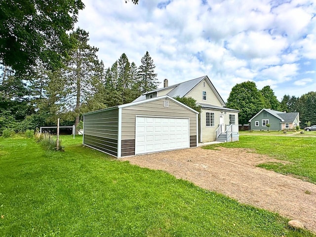 exterior space featuring a front yard and a garage