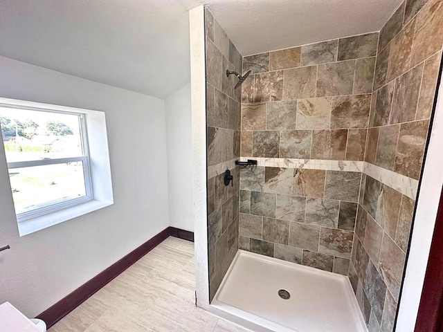 bathroom featuring tiled shower