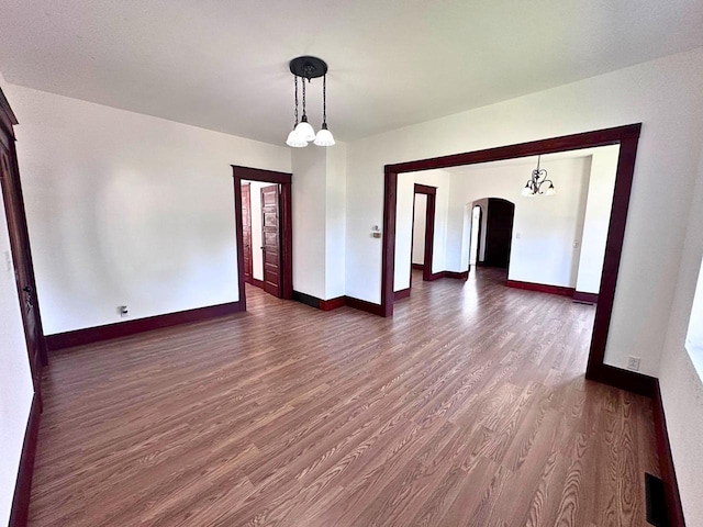 unfurnished room featuring dark hardwood / wood-style flooring