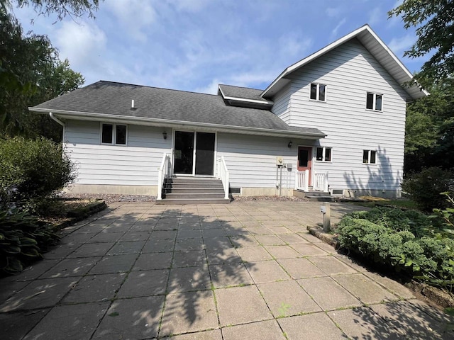 rear view of property featuring a patio area