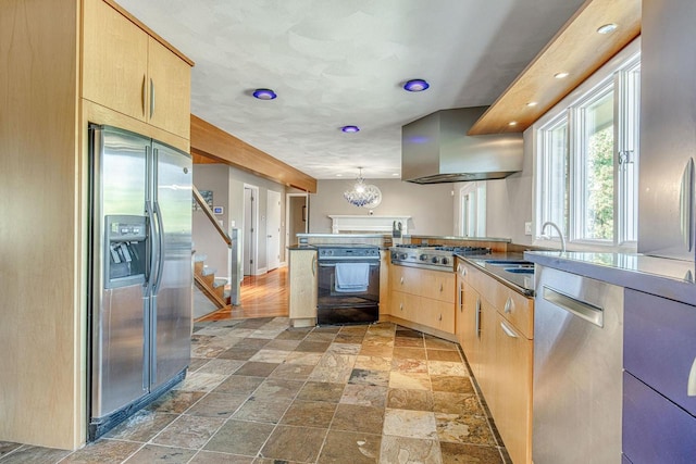 kitchen with decorative light fixtures, stainless steel appliances, light brown cabinetry, sink, and range hood