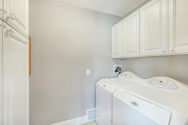 washroom with cabinets, tile patterned floors, and independent washer and dryer