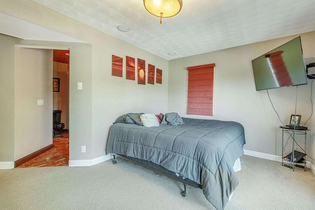 carpeted bedroom featuring a textured ceiling