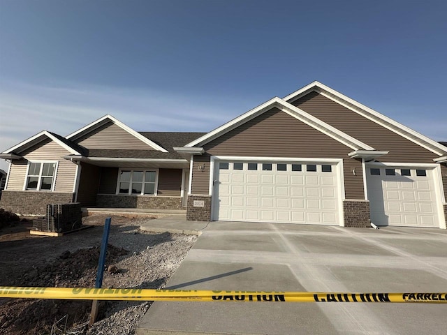 view of front facade featuring central AC and a garage