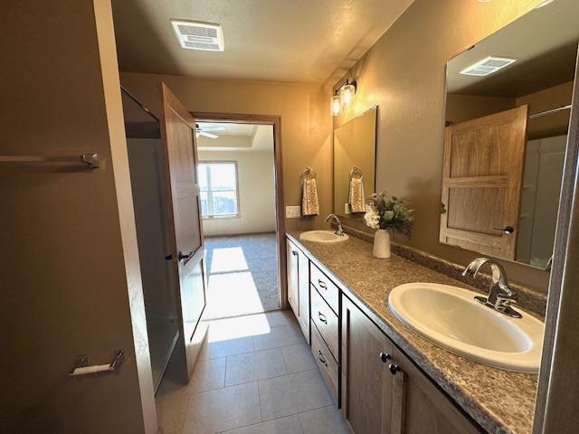 bathroom with vanity and tile patterned flooring