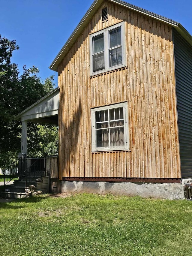 view of property exterior featuring a yard