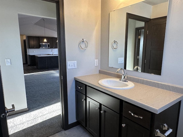 bathroom with decorative backsplash and vanity