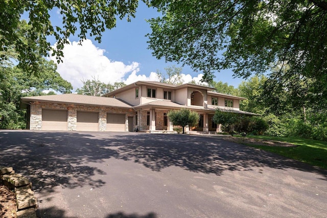 prairie-style home featuring a garage