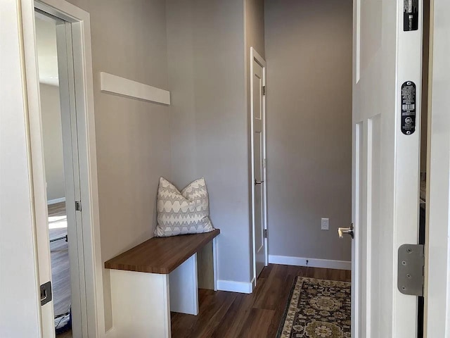 corridor with dark wood-type flooring