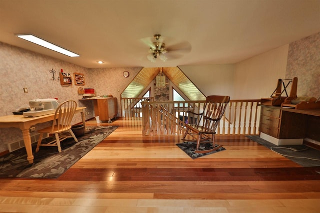 interior space with ceiling fan and hardwood / wood-style floors