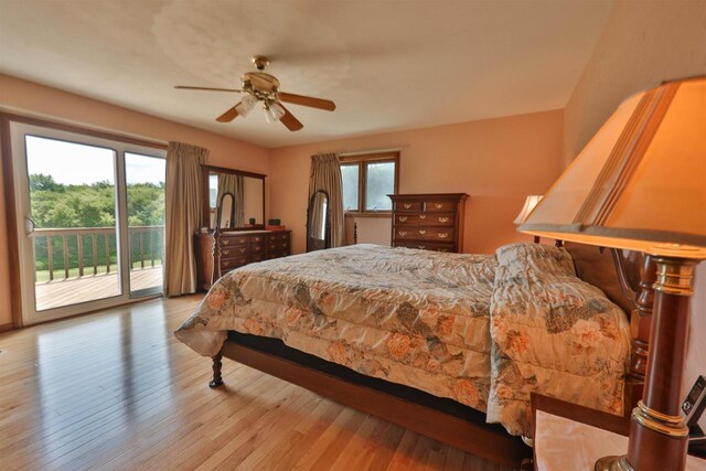 dining space with ceiling fan and wood-type flooring