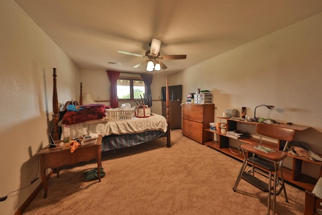 bedroom featuring ceiling fan and light carpet