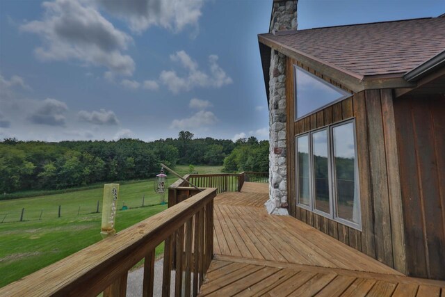 wooden terrace with a yard