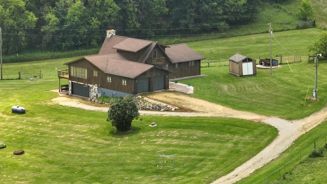 birds eye view of property with a rural view