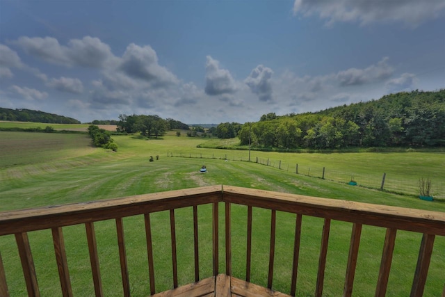 view of yard featuring a balcony and a rural view