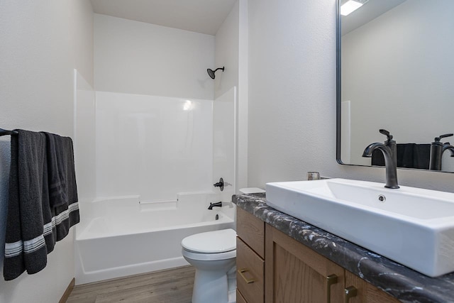 full bathroom with toilet, vanity, shower / bathing tub combination, and hardwood / wood-style floors