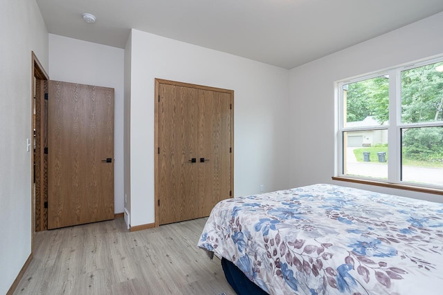 bedroom with light hardwood / wood-style floors