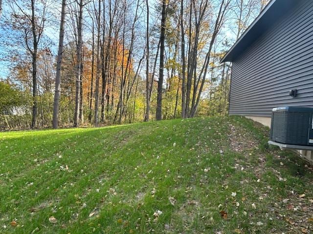 view of yard with central AC unit