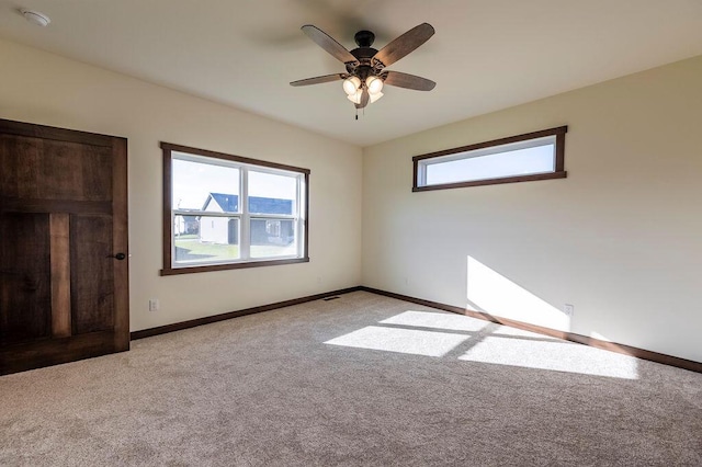 unfurnished bedroom with light carpet and ceiling fan