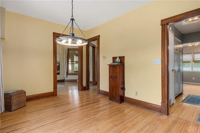 unfurnished dining area featuring light hardwood / wood-style floors