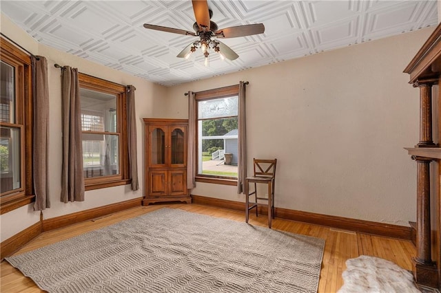 living area featuring ceiling fan and light wood-type flooring