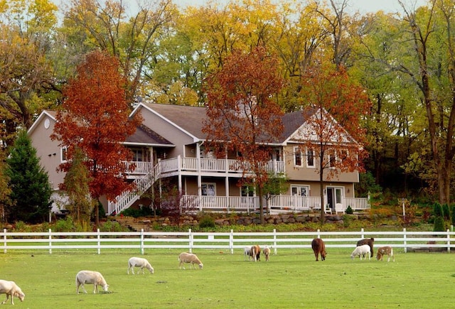 surrounding community with a yard and a rural view