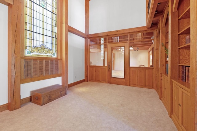 unfurnished living room with light carpet