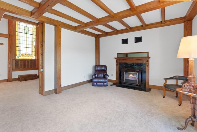 living room with beam ceiling, light colored carpet, a high end fireplace, and coffered ceiling