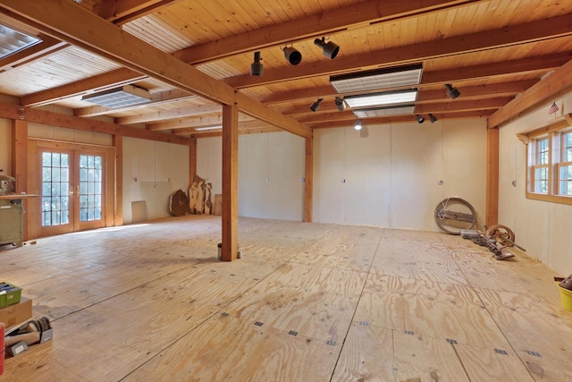 interior space with french doors, beamed ceiling, and rail lighting