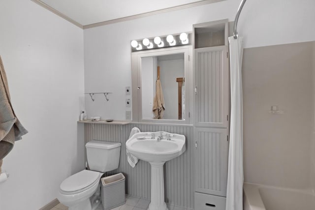 bathroom featuring toilet, ornamental molding, tile patterned floors, and sink