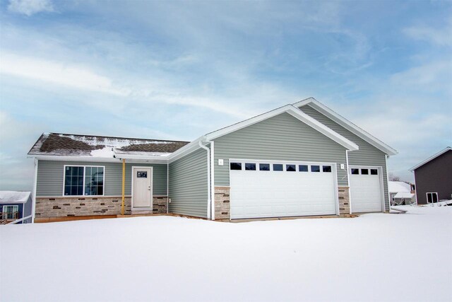 ranch-style home featuring a garage