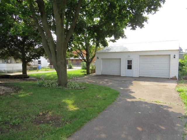 garage with a lawn