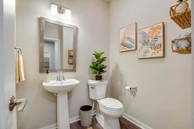 bathroom featuring sink and toilet