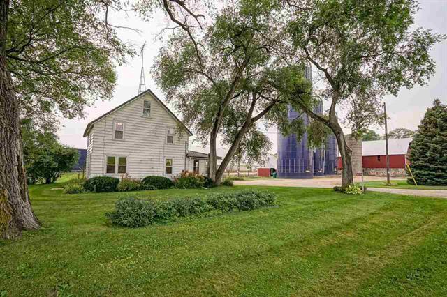 view of side of home with a lawn