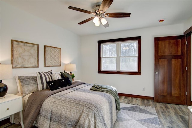 bedroom featuring ceiling fan and wood-type flooring