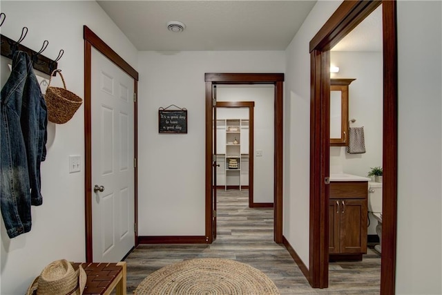 hallway featuring dark hardwood / wood-style flooring