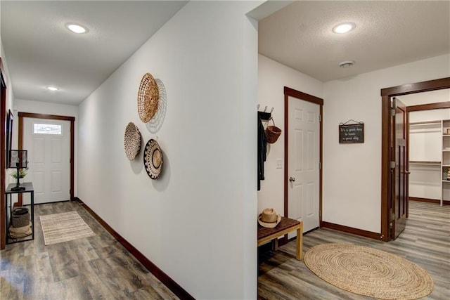 entryway with hardwood / wood-style flooring