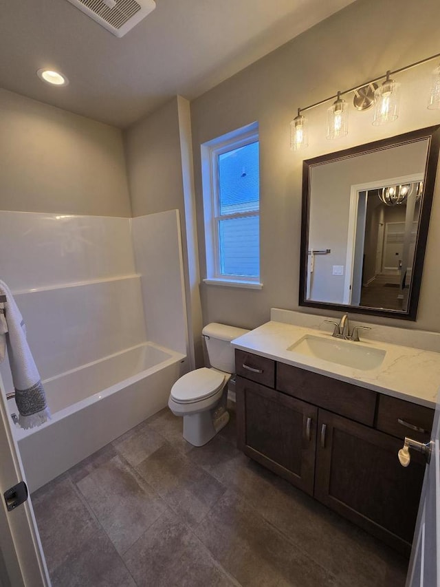 full bathroom featuring toilet, bathing tub / shower combination, and vanity