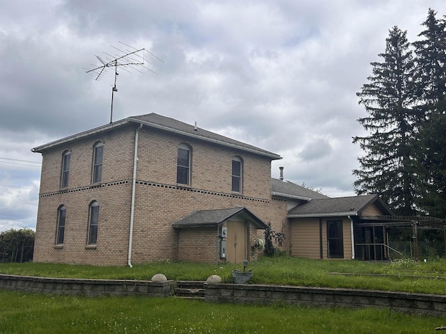 back of house with a yard