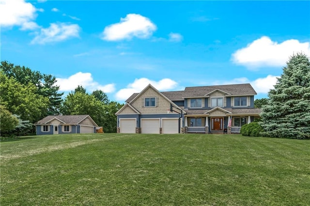 view of front of property featuring a garage and a front lawn