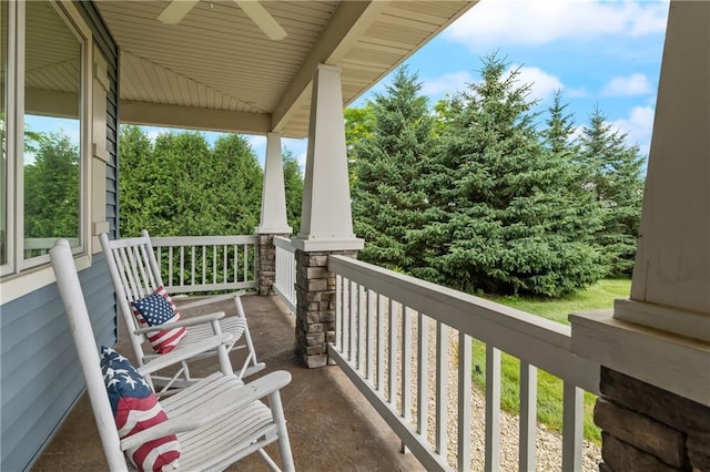 balcony with a porch and ceiling fan