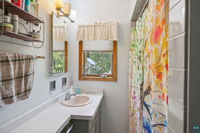 bathroom with vanity and curtained shower