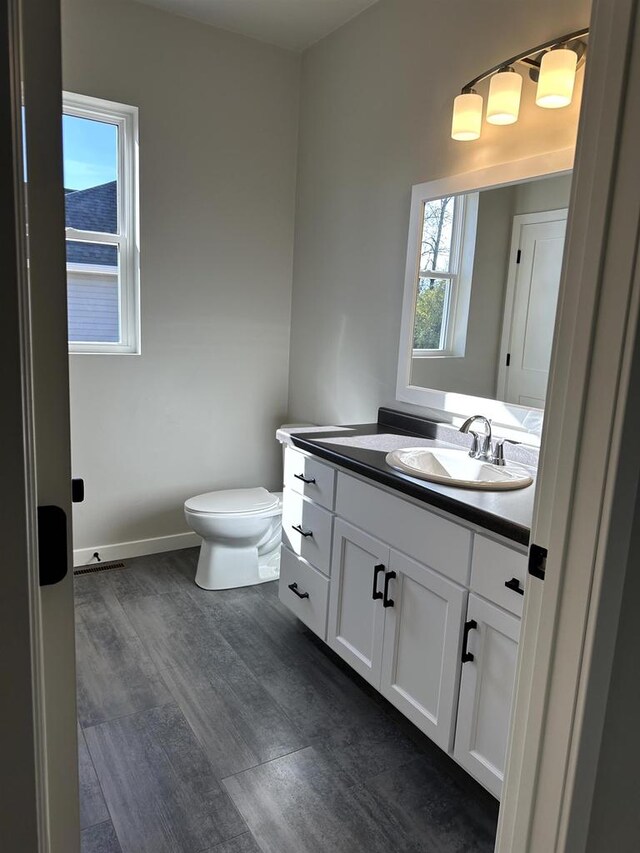 bathroom with vanity and toilet