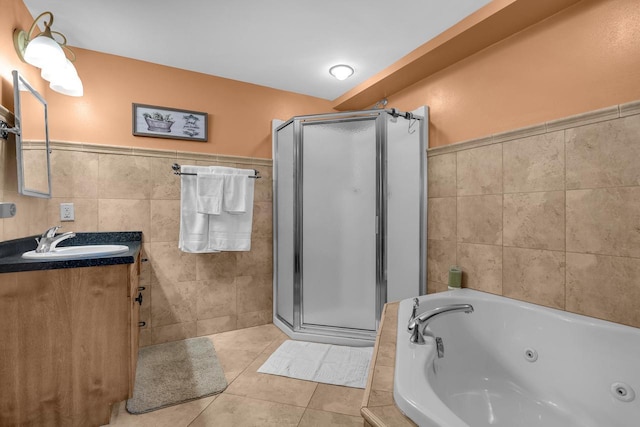 650 S Pier Dr Unit 2, Sheboygan, WI 53081 - bathroom featuring tile patterned flooring, shower with separate bathtub, tile walls, and vanity