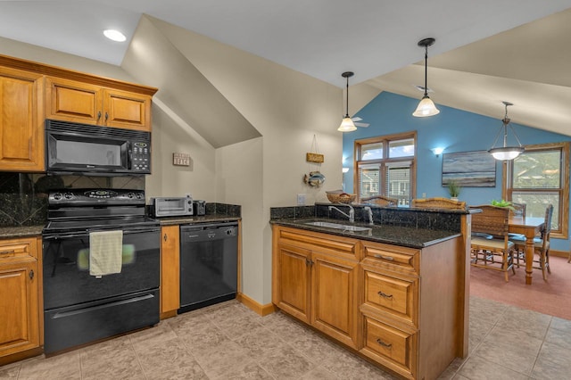 650 S Pier Dr Unit 2, Sheboygan, WI 53081 - kitchen with a wealth of natural light, decorative light fixtures, black appliances, sink, and kitchen peninsula